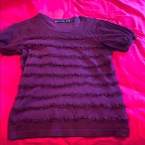 Purple blouse with the cutest ruffles.